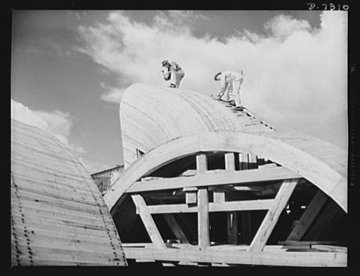 Tennessee Valley Authority. Construction of Douglas Dam. Workmen busy on draft forms at the TVA's new Douglas Dam on the French Broad River. This dam will be 161 feet high and 1,682 feet long, with a 31,600 acre reservoir area extending forty-three miles upstream. With a useful storage capacity of a