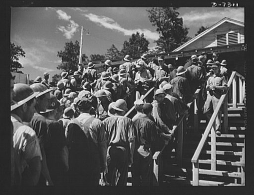 Tennessee Valley Authority. Construction of Douglas Dam. Pay day at the TVA's new Douglas Dam on the French Broad River. This dam will be 161 feet high and 1,682 feet long, with a 31,600 acre reservoir area extending forty-three miles upstream. With a useful storage capacity of approximately 1,330,0