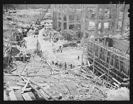 Tennessee Valley Authority. Construction of Douglas Dam. Excavating within the cofferdam of TVA's new Douglas Dam on the French Broad River. This dam will be 161 feet high and 1,682 feet long, with a 31,600 acre reservoir area extending forty-three miles upstream. With a useful storage capacity of a