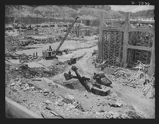 Tennessee Valley Authority. Construction of Douglas Dam. Excavating within the cofferdam of TVA's new Douglas Dam on the French Broad River. This dam will be 161 feet high and 1,682 feet long, with a 31,600 acre reservoir area extending forty-three miles upstream. With a useful storage capacity of a