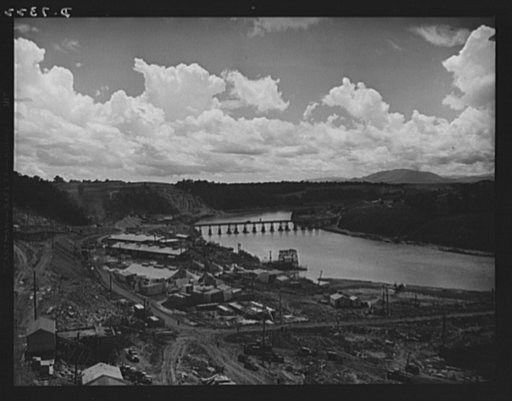 Tennessee Valley Authority. Construction of Douglas Dam. Loading downstream from TVA's new Douglas Dam on the French Broad River. This dam will be 161 feet high and 1,682 feet long, with a 31,600 acre reservoir area extending forty-three miles upstream. With a useful storage capacity of approximatel
