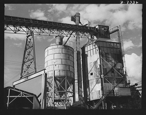Tennessee Valley Authority. Construction of Douglas Dam.  Concrete mixer at TVA's new Douglas Dam on the French Broad River. This dam will be 161 feet high and 1,682 feet long, with a 31,600 acre reservoir area extending forty-three miles upstream. With a useful storage capacity of approximately 1,3