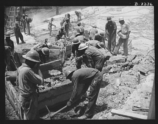 Tennessee Valley Authority. Construction of Douglas Dam.  Cleaning up bed rock at the site of TVA's new Douglas Dam on the French Broad River. This dam will be 161 feet high and 1,682 feet long, with a 31,600 acre reservoir area extending forty-three miles upstream. With a useful storage capacity of