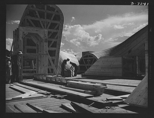 Tennessee Valley Authority. Construction of Douglas Dam.  Making forms for the generating plant to be built at TVA's new Douglas Dam on the French Broad River. This dam will be 161 feet high and 1,682 feet long, with a 31,600 acre reservoir area extending forty-three miles upstream. With a useful st