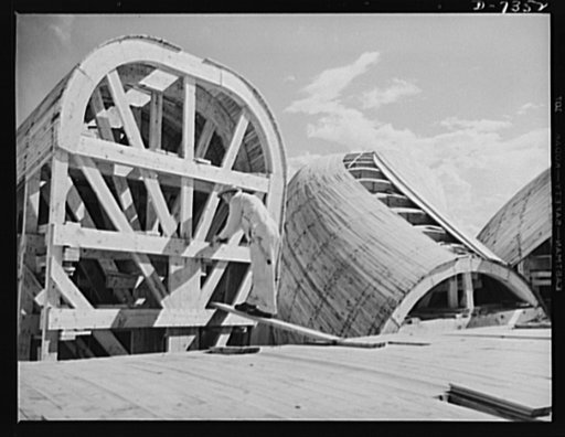 Tennessee Valley Authority. Construction of Douglas Dam. Making forms of the generating plant at TVA's new Douglas Dam on the French Broad River. This dam will be 161 feet high and 1,682 feet long, with a 31,600 acre reservoir area extending forty-three miles upstream. With a useful storage capacity
