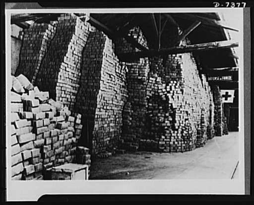Packages for prisoners of war and internees. Americans taken prisoners of war or interned by Germany and Italy regularly receive standard American Red Cross food packages, shown here stacked like bricks in the International Red Cross warehouse at Geneva, Switzerland. U.S. prisoners of war receive on