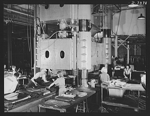 Production. Airplane manufacture, general. Women take over the operation of some of the heaviest tools at the Inglewood, Calfornia plant of North American Aviation Incorporated. Day and night, shifts of girl employees use this huge hydraulic press to form thousands of sheet metal parts for United Na