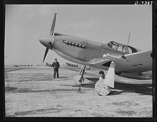 Production. Airplane manufacture, general. Wooden wheels are attached to a P-51 ("Mustang") fighter plane so it may be moved around the ramp at the Inglewood, California plant of North American Aviation, Incorporated. When it is ready for flight tests, regular landing wheels with rubber tires will b