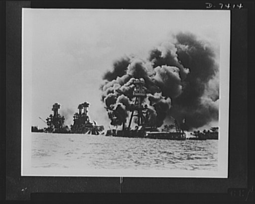 Pearl Harbor bombing. Stricken from the air. Testifying to the extent of the Japanese sneak attacks are these three stricken U.S. battleships. Left to right: USS West Virginia, severely damaged; USS Tennessee, damaged; and USS Arizona, sunk