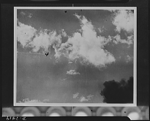 Pearl Harbor bombing. Raider is hit. The Japanese bomber, a thin line of smoke trailing in the wake, was struck by anti-aircraft fire during the attack on Pearl Harbor. More than 100 Jap planes are estimated to have taken part in the attacks, at least 28 of which were shot down by U.S. Navy gunners