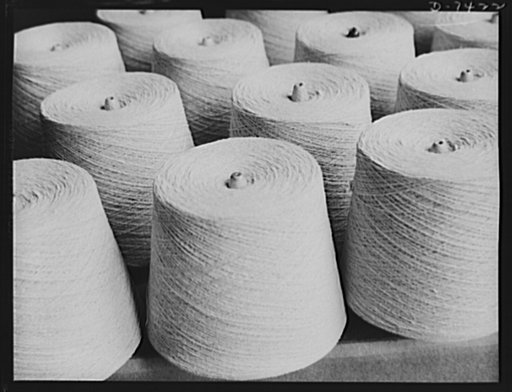 Discarded stockingss go to war. Spools of silk thread, salvaged from discarded stockings ready for packing and shipment to weaving mills which will convert the thread into cloth for the making of powder bags