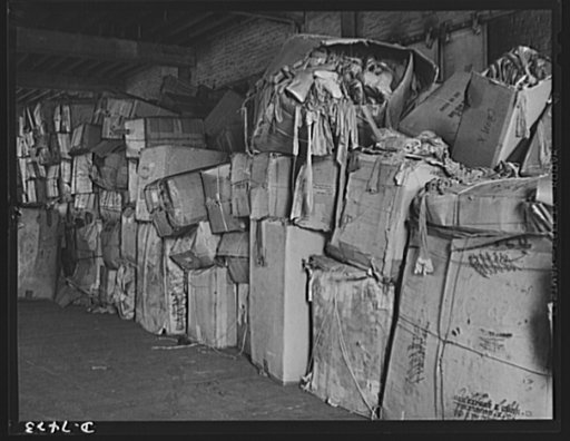 Discarded stockingss go to war. Some of the 2,500,000 pairs of silk stocking turned in for salvage during the first month of the collection campaign. The material is repacked into bales for storage at government warehouses and reshipment to processing plants