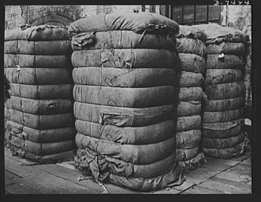 Discarded stockingss go to war. Bales of discarded silk stockings averaging about 1,000 pounds ready for shipment for reprocessing into powder bags