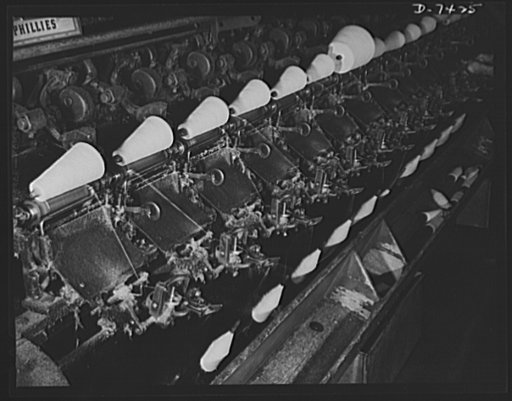 Discarded stockingss go to war. Bobbins of silk thread processed from discarded silk stockings are spun into spools prior to weaving into powder bags for use in heavy guns