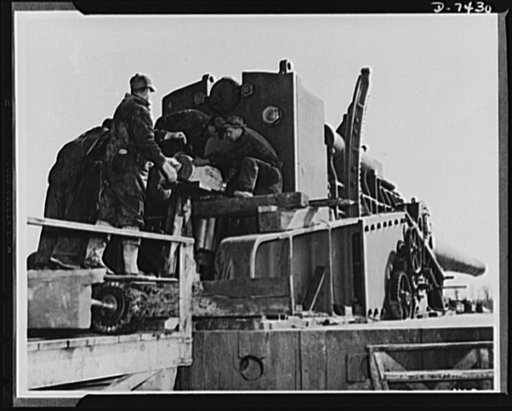 Discarded stockings go to war. It takes husky men to lift the heavy powder bags which are placed into big guns to throw the projectile. Discarded silk stockings, collected at various department stores and women's clubs throughout the country, are providing powder bags to keep our guns shooting