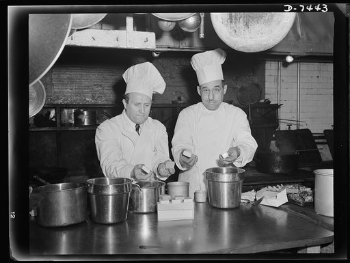 Dehydrated food luncheon at Senate. Chefs Denissen and Vernet open package of compressed dehydrated foods in the kitchen of the U.S. Senate restaurant. A dinner was prepared to show senators what the boys overseas are eating
