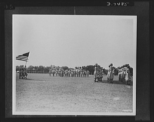 Women's Army Auxiliary Corps. WAACs are shown in review as part of ceremonies of the first graduating class at Fort Des Moines, Iowa, 1942
