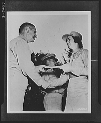 Women's Army Auxiliary Corps. Mary Bell Armstrong receives diploma from Major General James A Ulio, A.G.D. Miss Armstrong was the first WAAC so honored. Fort Des Moines, Iowa