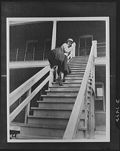 Women's Army Auxiliary Corps. Lorraine Stuteman of San Antonio, Texas, is shown carrying her barrack bag, which is filled with newly issued WAAC clothing, to her quarters. Fort Des Moines, Iowa