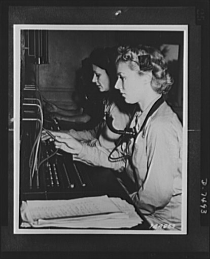 Women's Army Auxiliary Corps. Clare H. Pirie of Hollywood, California, in foreground is operating this switchboard part of the communication course for WAACs. Fort Des Moines, Iowa
