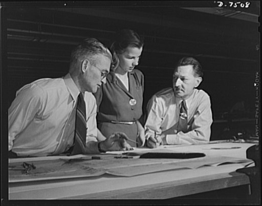 Production. Airplane manufacture, general. Two skilled engineers discuss a drawing of a plane part with a woman employee in the drafting department of the Inglewood, California, plant of North American Aviation, Incorporated. This plant produces the battle-tested B-25 ("Billy Mitchell") bomber, used