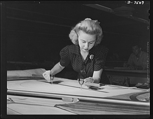 Production. Airplane manufacture, general. Women work side by side with men in the engineering department of the Inglewood, California, plant of North American Aviation, Incorporated. The young woman pictured traces complicated drawings of the thousands of parts that go into a modern fighting plane.
