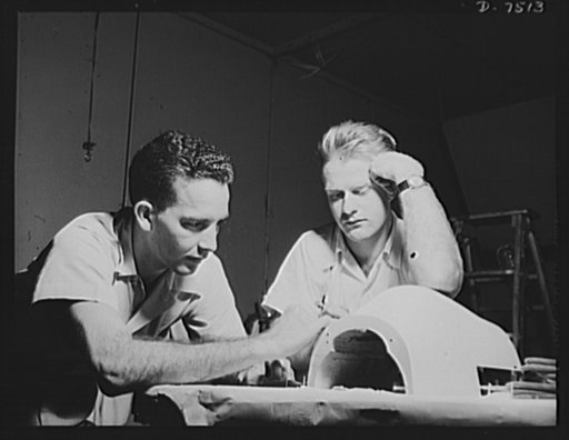Production. Airplane manufacture, general.  Model makers prepare accurately sealed minatures of planes built at the Inglewood, California, plant of North American Aviation, Incorporated. Here an experimental model of the P-51 ("Mustang") is being finished for wind tunnel and other tests. This plant 