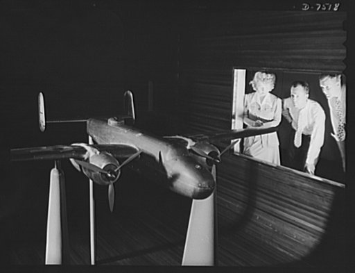Production. Airplane manufacture, general.  Member of the experimental staff at the Inglewood, California, plant of North American Aviation, Incorporated, observe wind tunnel tests on an accurate scale model of the B-25 ("Billy Mitchell") bomber. This plant produces the battle-tested B-25 ("Billy Mi