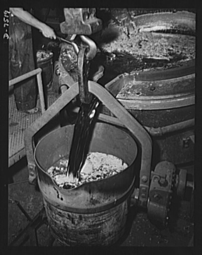 Production. Airplane manufacture, general.  Kirksite is poured from a melting pot into a pouring ladle in the Inglewood, California, foundry of North American Aviation, Incorporated. This substance is molded into dies for the forming of sheet metal parts for United Nations war planes. This plant pro