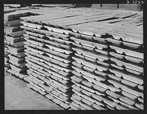 Production. Airplane manufacture, general.  Bars of Kirksite metal, ready to be placed in the melting pot for use in dies, stand outside the foundry at the Inglewood, California, foundry of North American Aviation, Incorporated. Dies of this metal are used in forming sheet metal parts of war planes 
