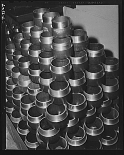 Production. Airplane manufacture, general. Finished parts for airplane landing gear are placed in containers as they are finished in the Inglewood, California, machine shop of North American Aviation, Incorporated. Hundreds of machines and skilled machinists turn out thousands of extremely accurate 