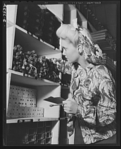 Production. Airplane manufacture, general. A clerk in one of the Inglewood, California, stockrooms of North American Aviation, Incorporated, checks parts for a sub-assembly department. This plant produces the battle-tested B-25 ("Billy Mitchell") bomber, used in General Doolittle's raid on Tokyo and