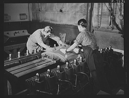 Production. Airplane manufacture, general. This stretching machine in the hydraulic press department of North American Aviation, Incorporated at Inglewood, California, forms sheet metal parts by stretching metal over a die. The sheet is stretched almost to its elastic limit so it will retain its for