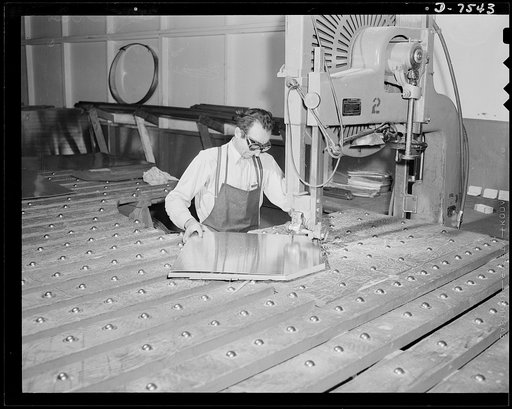 Production. Airplane manufacture, general. This huge hand saw at the Inglewood, California, plant of North American Aviation, Incorporated, cuts a dozen sheets of metal to the proper contour at one time. This plant produces the battle-tested B-25 ("Billy Mitchell") bomber, used in General Doolittle'