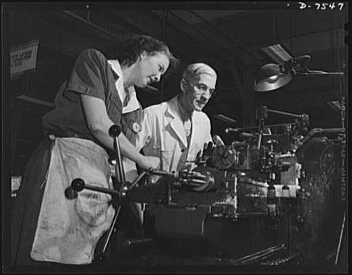 Production. Airplane manufacture, general. A woman employee operates a turret lathe under close supervision of a skilled machinist in a modern machine shop at the Inglewood, California, plant of North American Aviation, Incorporated. This plant produces the battle-tested ("Billy Mitchell") bomber, u