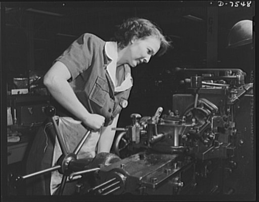 Production. Airplane manufacture, general. This woman employee operates a turret lathe in the machine shop at the Inglewood, California, plant of North American Aviation, Incorporated. She handles the machine as skillfully as a man. This plant produces the battle-tested ("Billy Mitchell") bomber, us