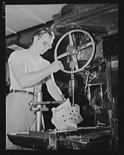 Production. Airplane manufacture, general. A employee in the drill press section of North American's huge machine shop at Inglewood, California, runs mounting holes in a large dural casting. This plant produces the battle-tested B-25 ("Billy Mitchell") bomber, used in General Doolittle's raid on Tok