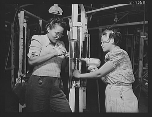 Production. Airplane manufacture, general. Two Negro women employees in North American Aviation's wing sub-assembly department at Inglewood, California, drill and rivet wing sections for fighter and bomber planes. This plant produces the battle-tested B-25 ("Billy Mitchell") bomber, used in General 