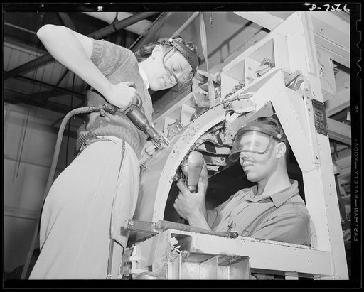 Production. Airplane manufacture, general. Two North American employees at Inglewood, California, rivet a nacelle door. This plant produces the battle-tested B-25 ("Billy Mitchell") bomber, used in General Doolittle's raid on Tokyo, and the P-51 ("Mustang") fighter plane, which was first brought int