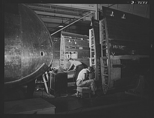 Production. Airplane manufacture, general. Wing sections for B-25 bombers and P-51 fighters, move down long assembly lines at North American Aviation plant at Inglewood, California. This plant produces the battle-tested B-25 ("Billy Mitchell") bomber, used in General Doolittle's raid on Tokyo, and t