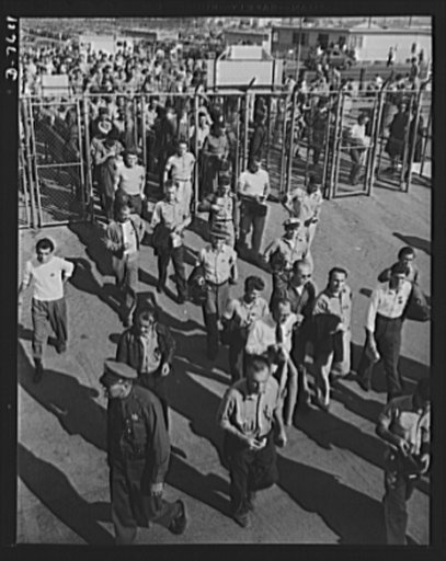 Production. Airplane manufacture, general. Thousands of North American Aviation employees came through these gates at the Inglewood, California, plant each day. Employees must display their badges and identification cards before admittance. This plant produces the battle-tested B-25 ("Billy Mitchell