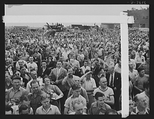 Production. Airplane manufacture, general. Thousands of North American Aviation employees at Inglewood, California look skyward as the bomber and fighter planes they helped build perform overhead during a lunch period air show. This plant produces the battle-tested ("Billy Mitchell") bomber, used in