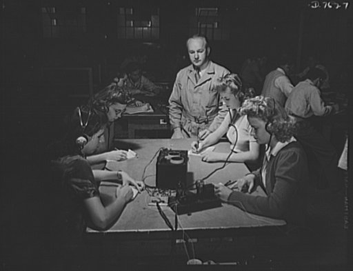 Victory Corps, tomorrow's defenders of liberty. With radio becoming more and more a fighting force in the war, girls are being trained alongside men in this important field. Victory Corps members at Polytechnic High School in Los Angeles, California, will be prepared for war work when they complete 