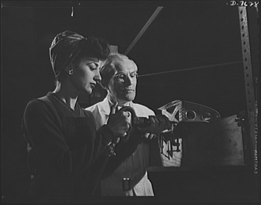 Victory Corps, tomorrow's defenders of liberty. Experienced workers train young girls in the high school Victory Corps to become valuable members of the vast womanpower army. Sally Brown, who is learning to rivet airplane parts at Roosevelt High School in Los Angeles, California, will be ready for s