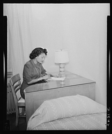 War worker goes to Washington. So that the folks back home in Cleveland, Ohio, will not worry, Miss Clara Camille Carroll sits right down to the desk in her new room at the Lucy D. Slowe Resident Hall and writes them all about it