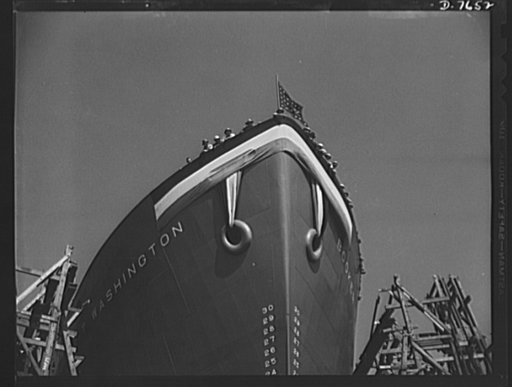 Production. Launching of the SS Booker T. Washington. Shipyard workers of many racial groups which helped construct the SS Booker T. Washington, first Liberty Ship named for a Negro, wave from the deck of the vessel a short time before it was launched at the California Shipbuilding Corporation's yar