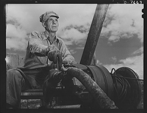Tennessee Valley Authority. Construction of Douglas Dam. Pneumatic winch operator at TVA's new Douglas Dam on the French Broad River. This dam will be 161 feet high and 1,682 feet long, with a 31,600 acre reservoir area extending forthy-three miles upstream. With a useful storage capacity of approxi