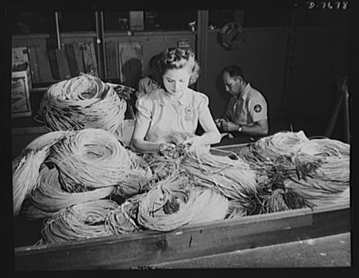 Production. B-25 "Billy Mitchell" bombers. Thousands of feet of insulated conductor wire that go into a North American B-25 bomber are sorted by this woman employee in the electrical assembly department at Inglewood, California. In addition to the battle-tested B-25 "Billy Mitchell" bomber, used in 