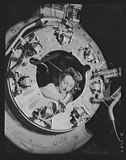 Production. B-25 "Billy Mitchell" bombers. Part of the cowling for one of the motors for a B-25 bomber is assembled in the engine department of North American's Inglewood, California, plant. In addition to the battle-tested B-25 "Billy Mitchell" bomber, in General Doolittle's raid on Tokyo, this pla