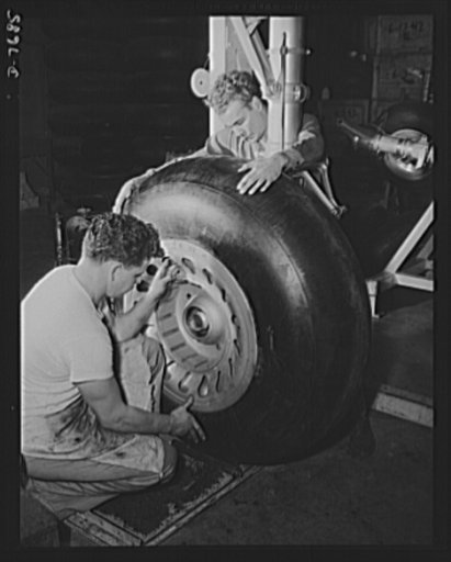 Production. B-25 "Billy Mitchell" bombers. A huge rubber tire is mounted on the landing gear strut of a B-25 bomber before it moves to the final assembly line of North American's Inglewood, California, plant. In addition to the battle-tested B-25 "Billy Mitchell" bomber, in General Doolittle's raid 